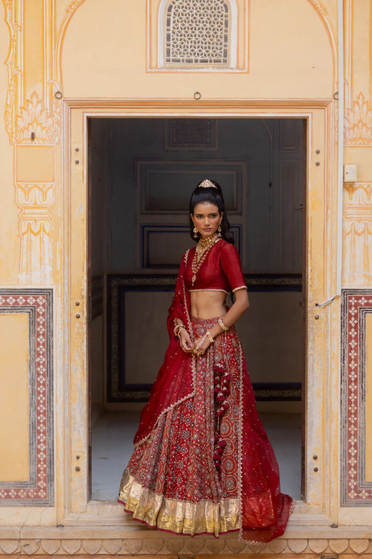 Woman in a red traditional outfit.