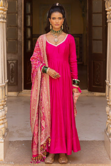 Anarkali set with delicate work at the neckline paired with a heavy bandhani dupatta