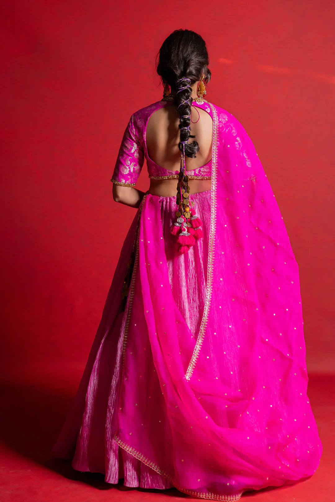 Munga blouse with heavy tassels along with a tissue lehenga