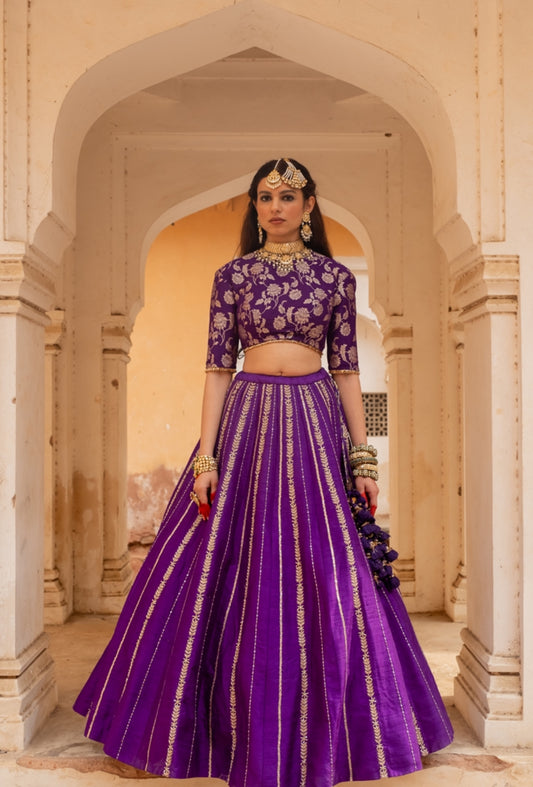 Elegant purple banarasi blouse paired with raw silk skirt