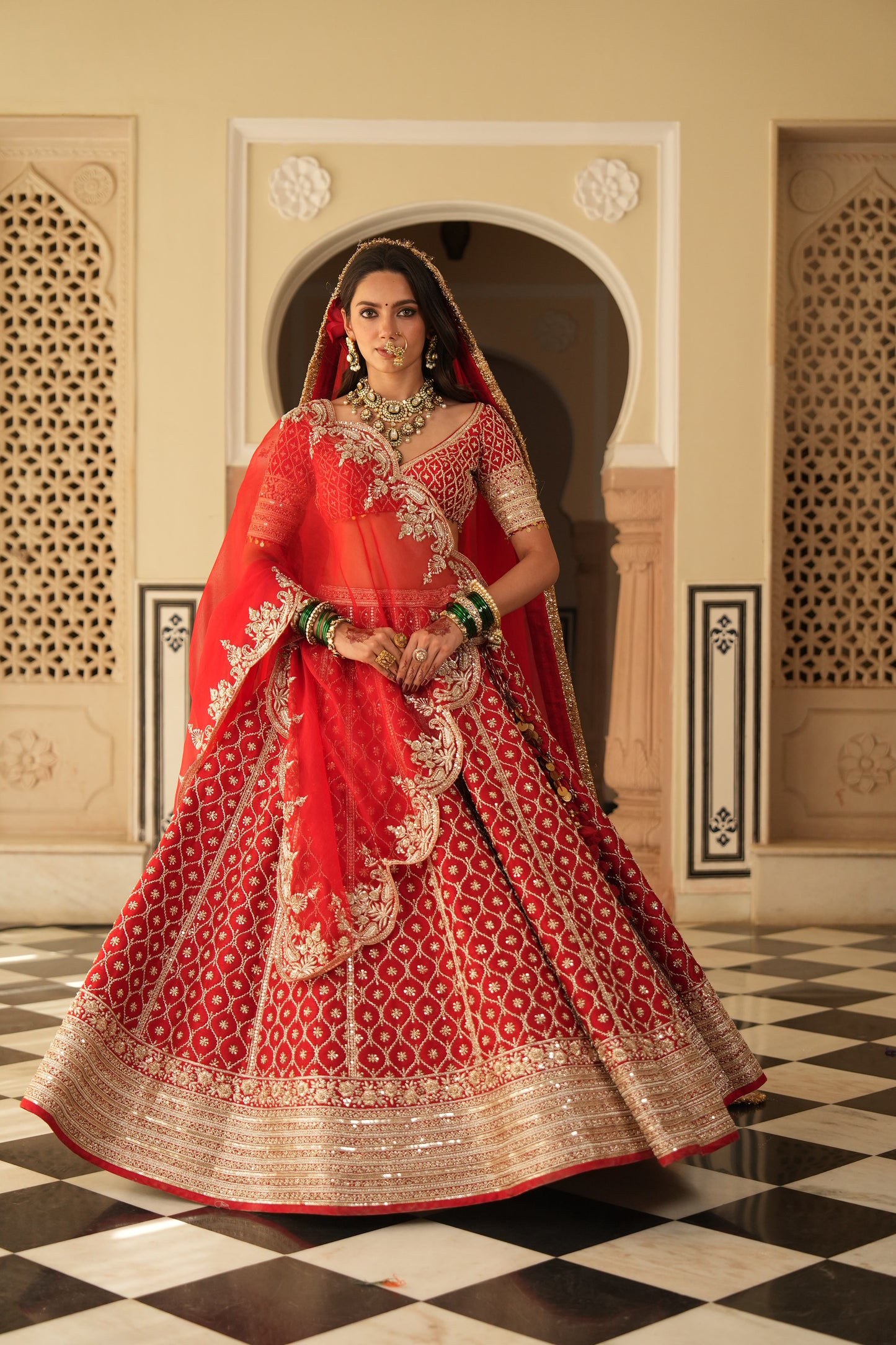 Traditional red wedding lehenga with heavy border
