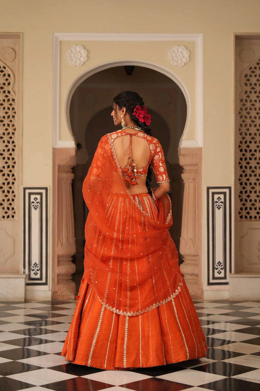Handcrafted raw silk skirt paired with Muga blouse and draped dupatta